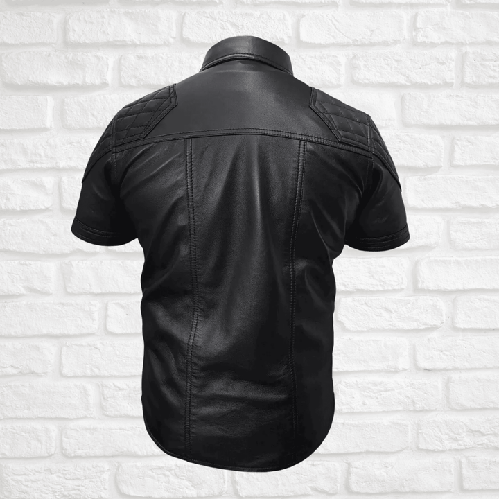 Men's leather shirt,
Short sleeve leather shirt,
Black leather shirt men,
Stylish leather shirt for men,
Quilted leather shirt,
Biker leather shirt,
Motorcycle leather shirt,
Casual leather shirt,
Men's fashion leather shirt,
Leather shirt with pockets,
Leather shirt with quilted design,
Short sleeve biker shirt,
Black quilted leather shirt,
Leather shirt with button pockets,
Silver button leather shirt,
Rugged leather shirt men,
Faux leather shirt men,
High-quality leather shirt,
Leather shirt for summer