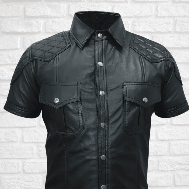 Men's leather shirt,
Short sleeve leather shirt,
Black leather shirt men,
Stylish leather shirt for men,
Quilted leather shirt,
Biker leather shirt,
Motorcycle leather shirt,
Casual leather shirt,
Men's fashion leather shirt,
Leather shirt with pockets,
Leather shirt with quilted design,
Short sleeve biker shirt,
Black quilted leather shirt,
Leather shirt with button pockets,
Silver button leather shirt,
Rugged leather shirt men,
Faux leather shirt men,
High-quality leather shirt,
Leather shirt for summer