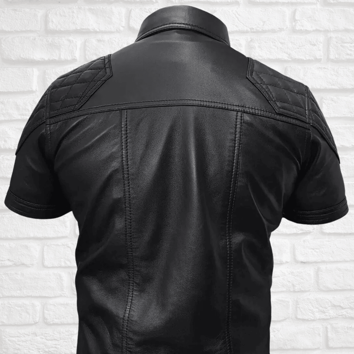 Men's leather shirt,
Short sleeve leather shirt,
Black leather shirt men,
Stylish leather shirt for men,
Quilted leather shirt,
Biker leather shirt,
Motorcycle leather shirt,
Casual leather shirt,
Men's fashion leather shirt,
Leather shirt with pockets,
Leather shirt with quilted design,
Short sleeve biker shirt,
Black quilted leather shirt,
Leather shirt with button pockets,
Silver button leather shirt,
Rugged leather shirt men,
Faux leather shirt men,
High-quality leather shirt,
Leather shirt for summer